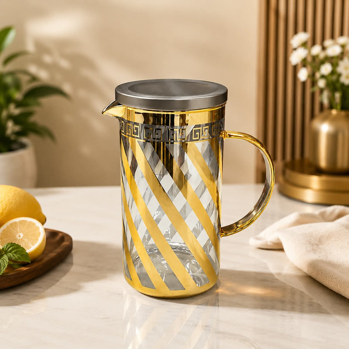 1350ml premium borosilicate glass jug with elegant gold finish for serving water, juice, lemonade, and other beverages.