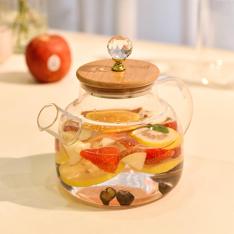 Premium glass teapot with matching tea cups and wooden holder
