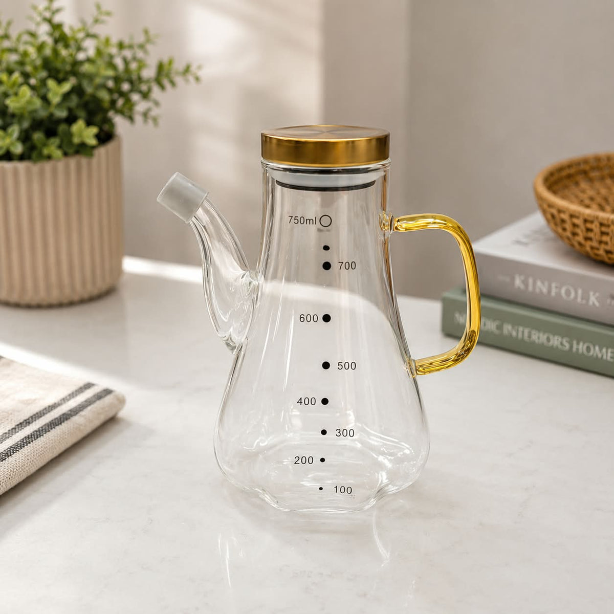 750ml heatproof glass oil pot with clear body and easy-pour design for storing and dispensing cooking oil, vinegar and other kitchen condiments.
