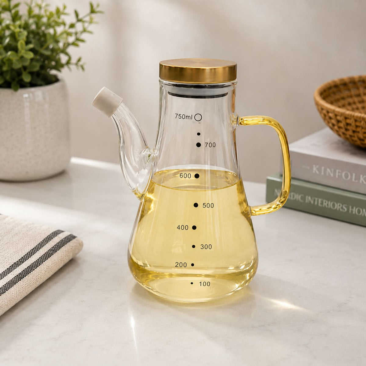 750ml heatproof glass oil pot with clear body and easy-pour design for storing and dispensing cooking oil, vinegar and other kitchen condiments.