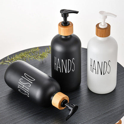 
Black glass soap dispenser for bathroom sink