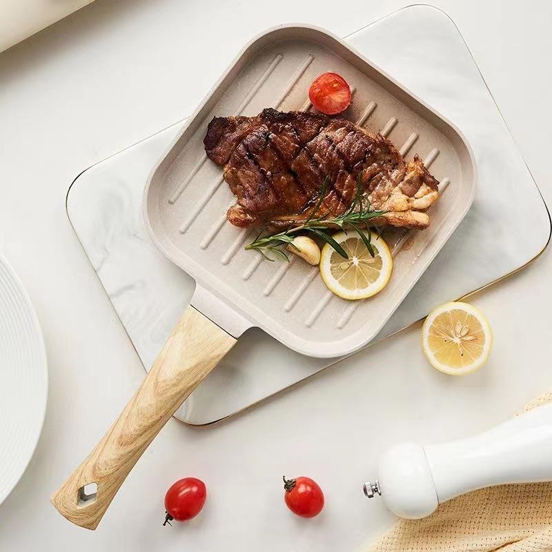 
Black granite steak pan with comfortable handle