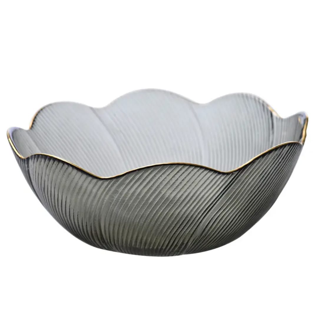 Decorative bowl with scalloped edge and ribbed texture on a white background