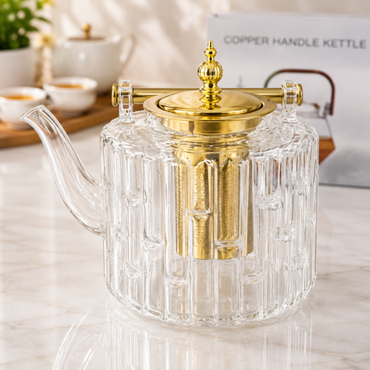 
Glass tea pot with removable tea infuser and gold handle