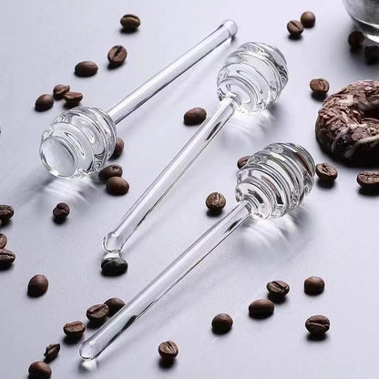 
Glass honey pot with honey dipper