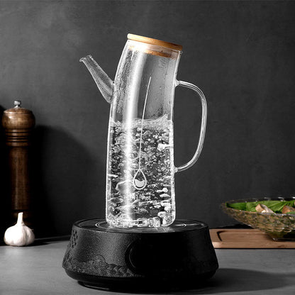 
Glass oil dispenser with natural bamboo lid