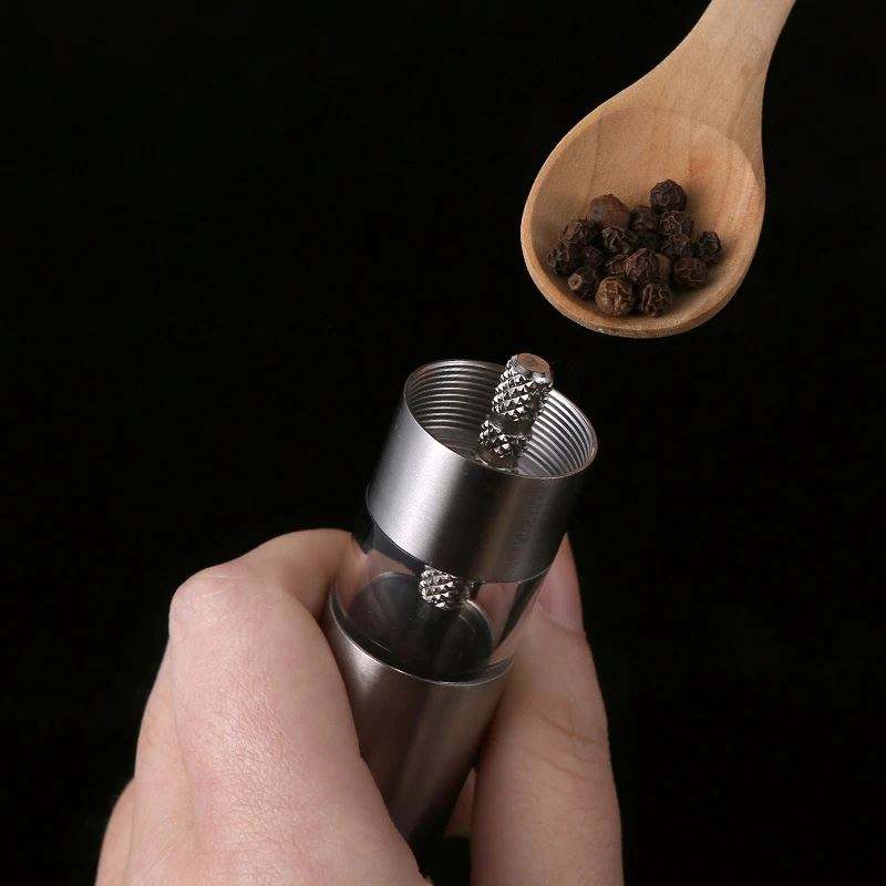 
Manual pepper grinder with ergonomic press handle