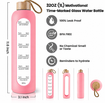 Pink glass water bottle with a wooden cap and carrying loop, shown on a white background with measurement labels, feature icons, and smaller product views. The bottle has a printed time-marked hydration tracker on the front.