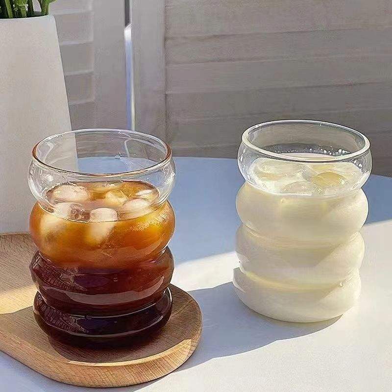 Premium clear borosilicate glass cup with straw