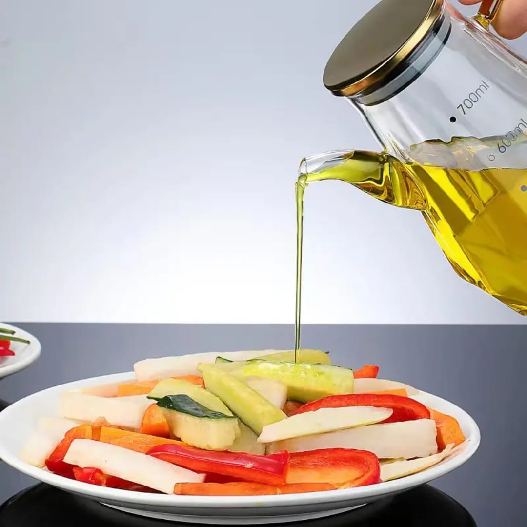 
Transparent glass olive oil dispenser with pour spout