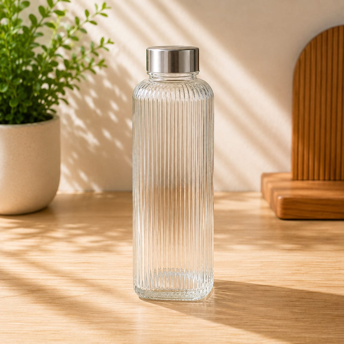 Premium quality 1 liter clear glass water bottle, reusable drinking bottle for home, office, gym, travel and everyday beverage use.