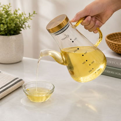 750ml heatproof glass oil pot with clear body and easy-pour design for storing and dispensing cooking oil, vinegar and other kitchen condiments.