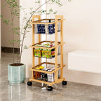 Wooden storage cart with wheels in a room setting with a plant and bench.